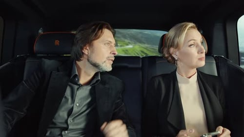 Elegant Couple Enjoying a Scenic Mountain Drive