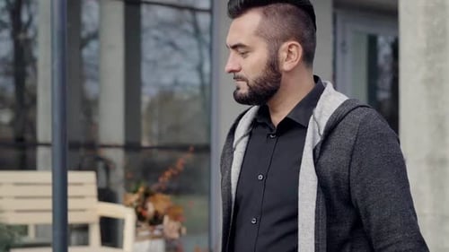 Closeup Portrait of a Man Casually Walking in City in Day Time