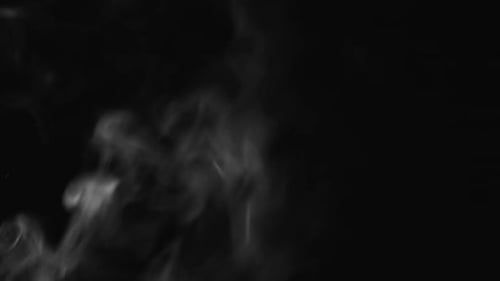 Billowing Gray Smoke Rising on a Black Background