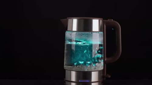 Electric Kettle Boiling Water with Blue Illumination