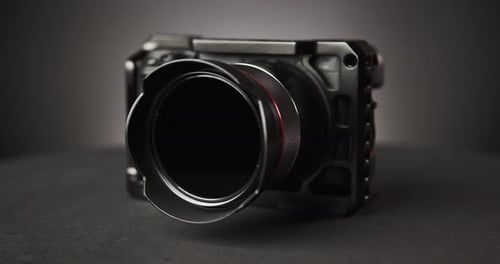 Professional Black Camera on a Neutral Background