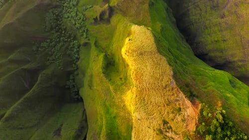 Topdown View Over Exotic Terrain of Tropical Island Under the Bright Sunset Light