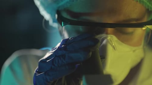 Scientist Working in Laboratory with Microscope