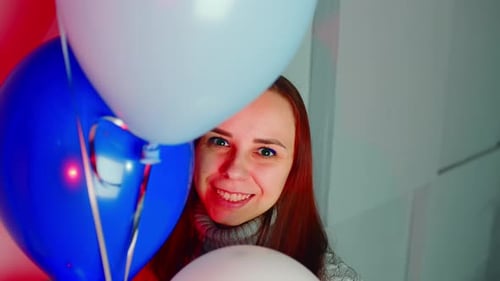 Woman Smiles Behind Colorful Balloons, Birthday