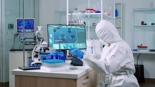 Researchers in Protective Suits Working in a Laboratory