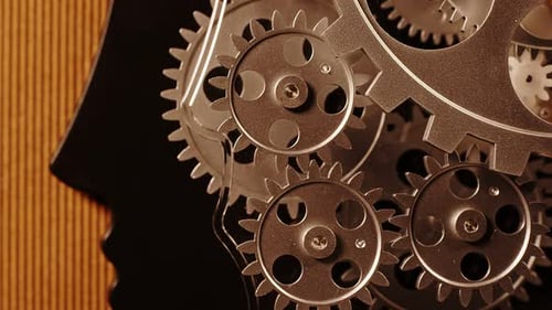 Gears Turning in Silhouette of Human Head