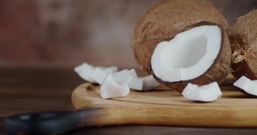 Sliced Coconut on Wooden Cutting Board Still Life