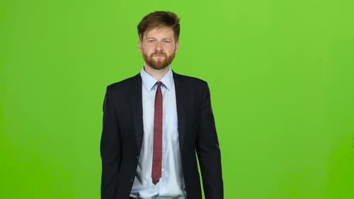 Businessman Walks Calmly Down the Street, He Is Happy. Green Screen