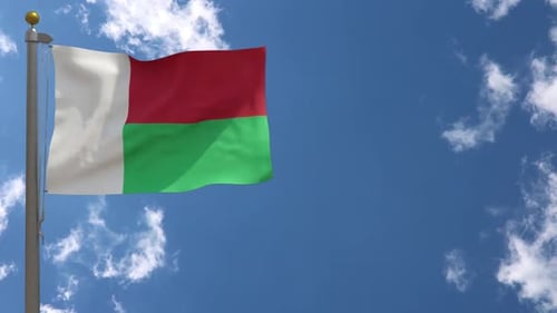 Flag of Madagascar Waving in the Wind with Blue Sky