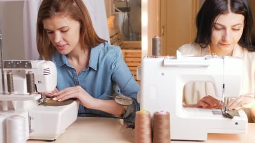 Women Working on Sewing Machines Indoors