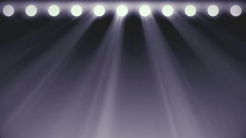 Bright stage lights flashing in white color seamless loop