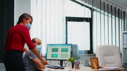 Teamwork in Modern Office with Medical Face Masks