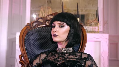 Elegant Woman with Blunt Hair Posing in Chair