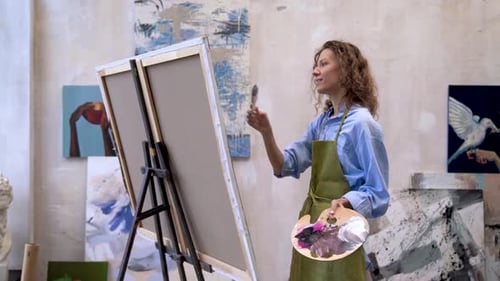 Female Artist Painting in Art Studio