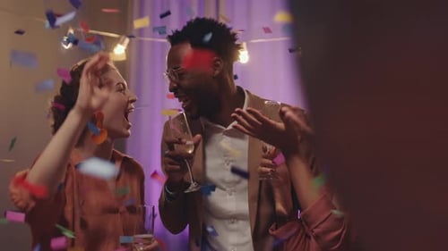 Happy Friends Celebrate Together at Home with Champagne