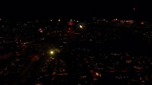 Colorful Fireworks Illuminated Cityscape During The Celebration Of New Year In Iceland. Aerial Wide