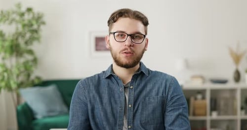 Young Adult Talking to the Camera at Home
