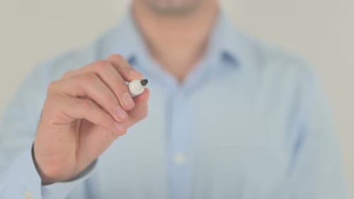 Hand Writes "START" on Transparent Surface