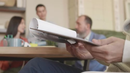 Business Meeting with Financial Charts and Data