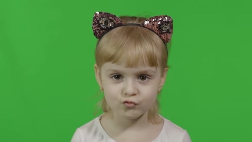 Girl Smiles in Cat Ears Headband, Green Screen
