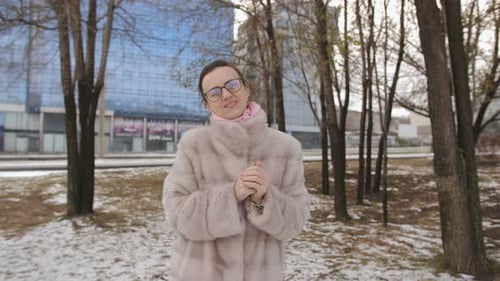 Woman in Elegant Coat Winter Walks on the Park