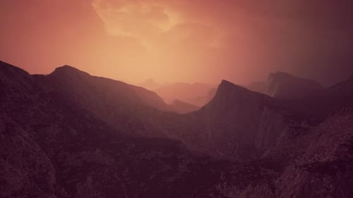 Dramatic Sky Over Rocky Mountains at Sunset