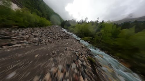Cinematic Fpv Drone Shot Flying Low Along the Mountain River
