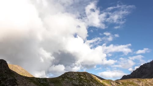 Dramatic Mountains and Clouds Under Open Sky