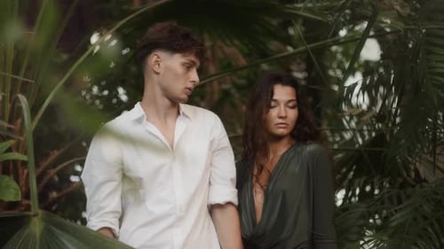 Attractive Couple Posing in Lush Tropical Environment