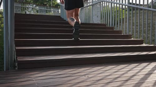 Man Jogging Up Stairs in Urban Environment