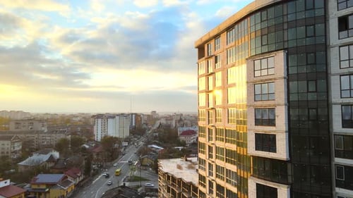 Aerial view of high residential apartment building under construction. Real estate development.