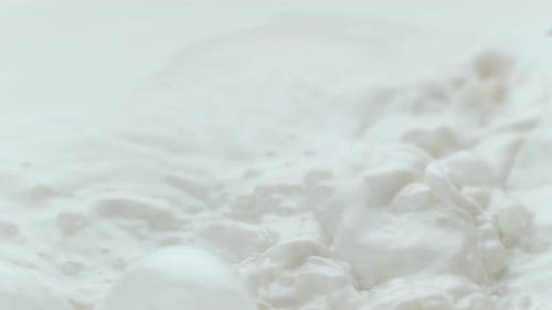 Milk pouring and splashing in slow motion; shot on Phantom Flex 4K at 1000 fps