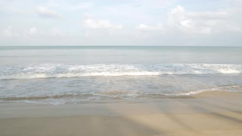 natural sea wave water with foam on the sandy beauty white beach, summer beac
