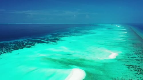 Aerial landscape of idyllic resort beach trip by shallow sea and white sandy background of a dayout