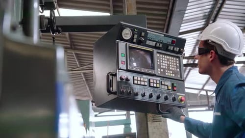 Smart Factory Worker Using Machine in Factory Workshop