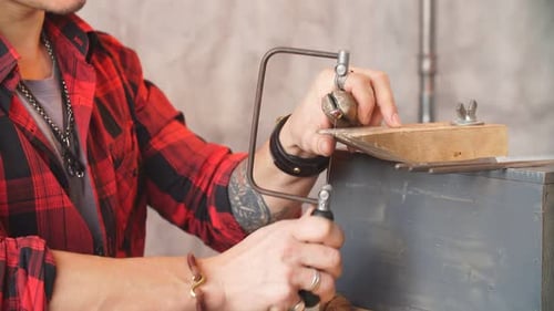 Jeweler Saws the Item at Workplace, Profession, Job