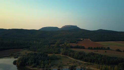 View of lake with field