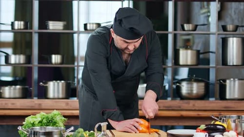 Chef Cuts Bell Pepper in Professional Kitchen