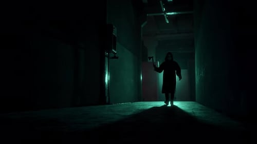 Hooded Figure with Axe Walks Dark Hallway