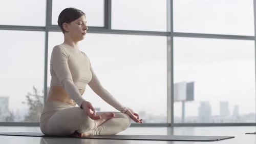Woman Practicing Yoga for Health and Fitness