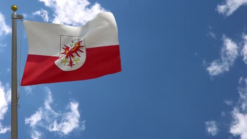 Tyrol Flag Waving Against Blue Sky with Clouds