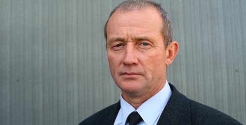 Adult Man in Suit Standing Confidently