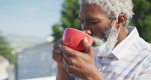 Senior Man Enjoying Morning Beverage Outdoors