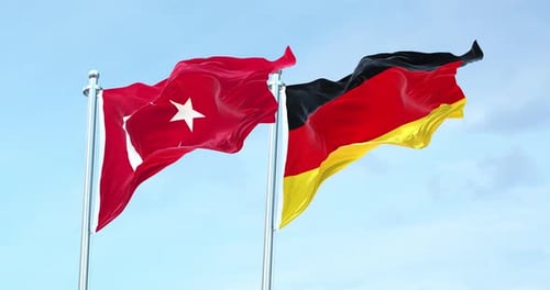Realistic Turkey and Germany Flags Waving Together in Wind