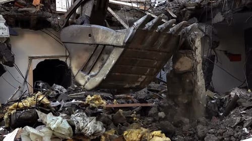 Excavator Demolishing Building, Creating Pile of Rubble