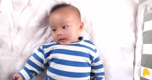 Top View Of Happy Asian Baby