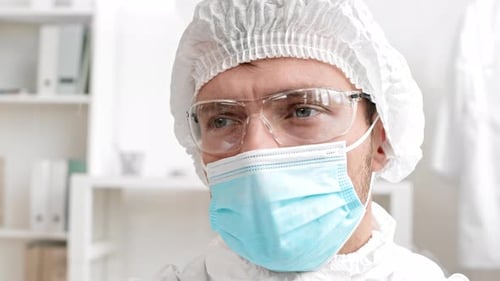 Health Professional in Protective Gear in a Workplace