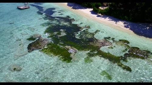 Aerial flying over seascape of luxury coast beach voyage by turquoise water with white sandy backgro