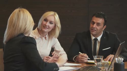 Team Brainstorming Business Strategies in Conference Room