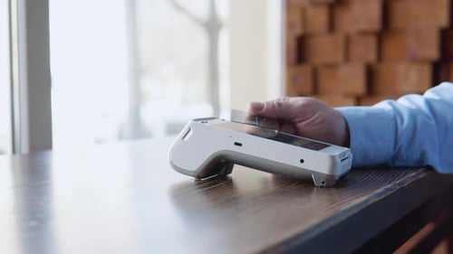 Credit Card Being Swiped Through Card Reader